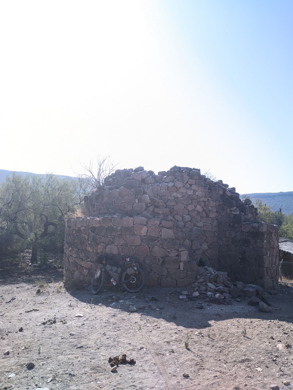 this was a strange circular tower in the middle or nowhere, with just a tiny access hole in the bottom